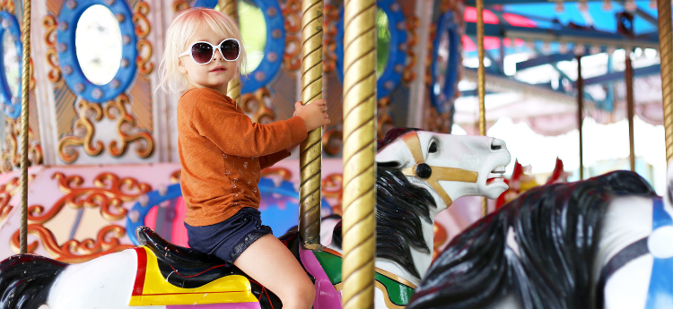 Female child on a carousel 