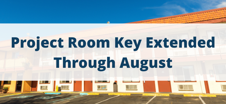Motel building background - "Project Room Key Extended through August"
